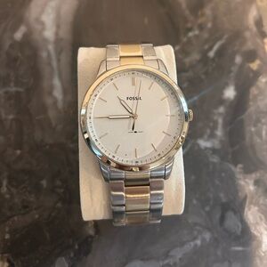 Men’s large gold and silver Fossil Watch. Brand new Condition with film tape.